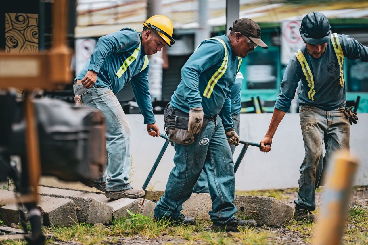 Team of construction workers collaborating on a project in San José, Costa Rica.